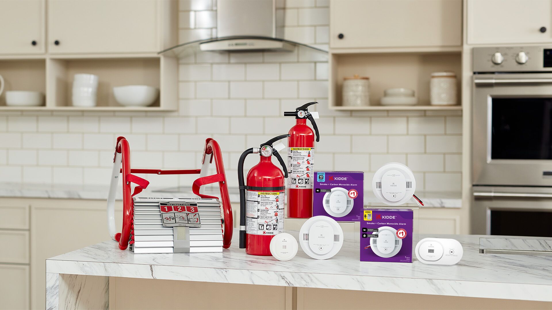 A group of Kidde fire safety products on a kitchen counter.