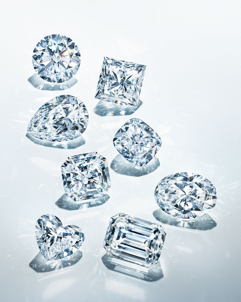 Eight pieces of diamonds showcasing various shapes including heart, pear, oval, princess, emerald, round, cushion, and the exclusive Tiffany True® Cut.