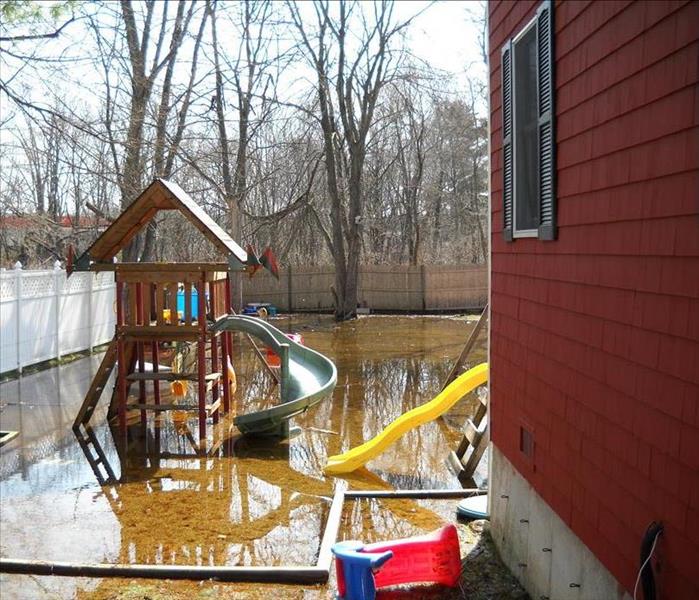 This property was harshly affected by an early winter storm. You can see in the photo, the water line was well above the ground across their back yard. The basement was the most affected area within the home due to the amount of flooding.