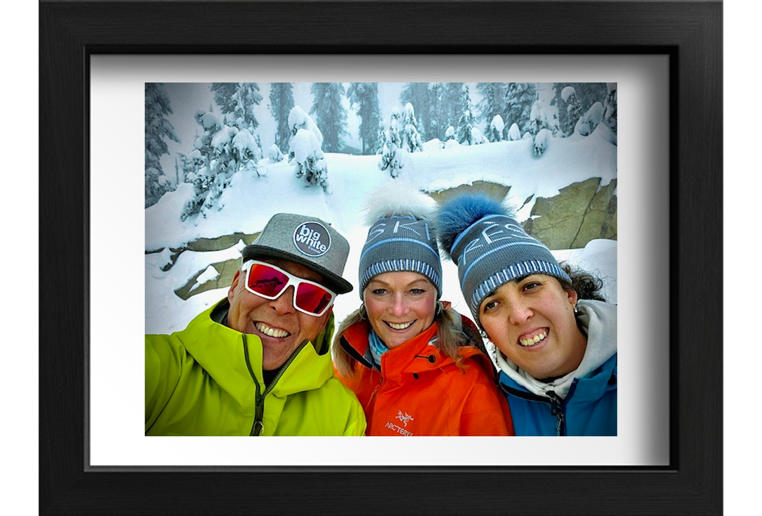 A photo of Kevin, Denise, and their daughter.