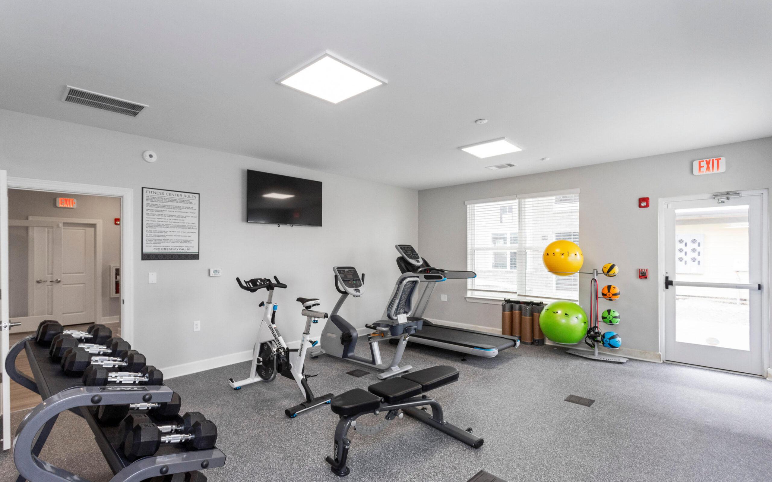 Fitness center with free weights and cardio machines