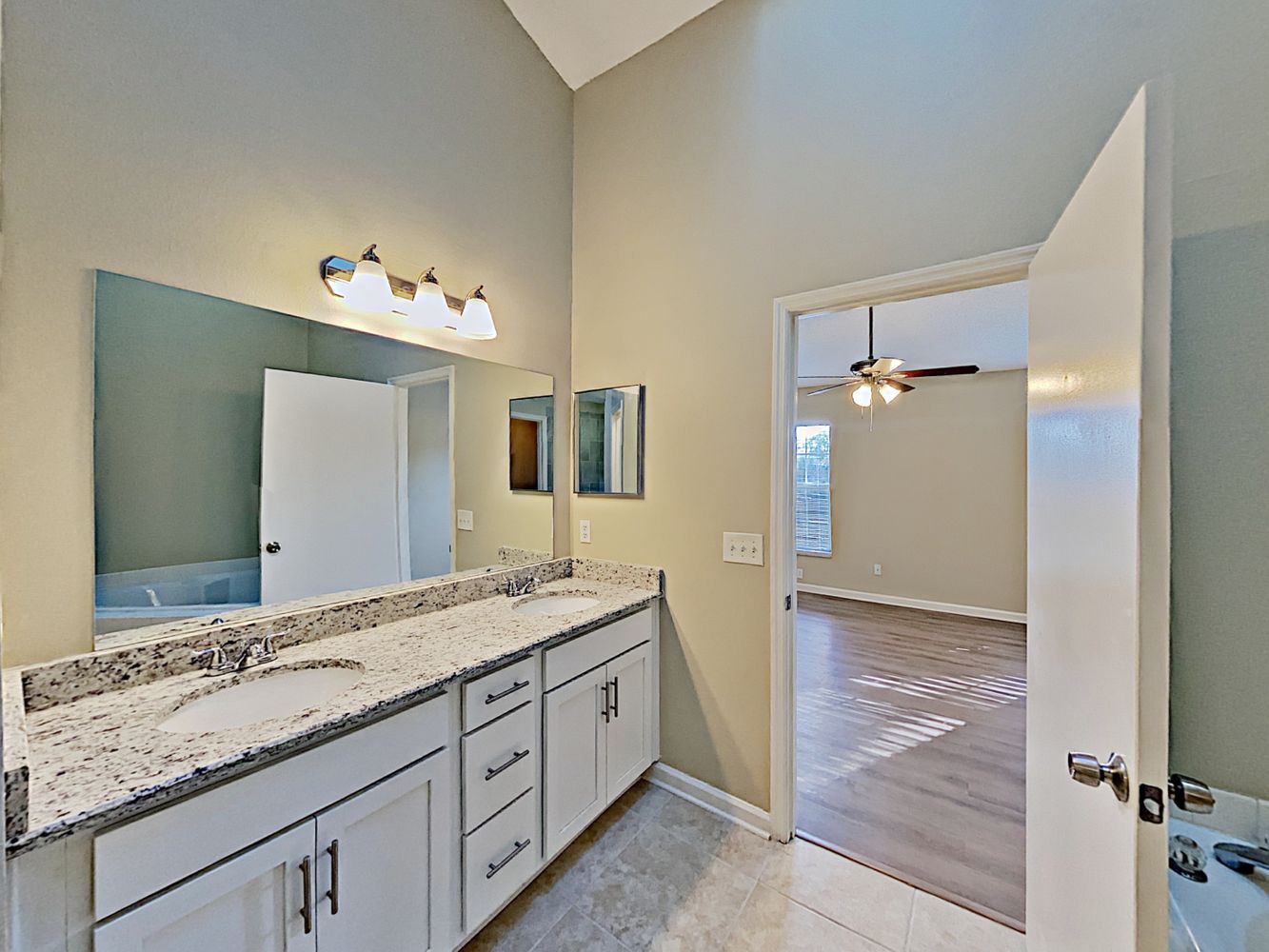 Spacious bathroom with two sinks at Invitation Homes Orlando.