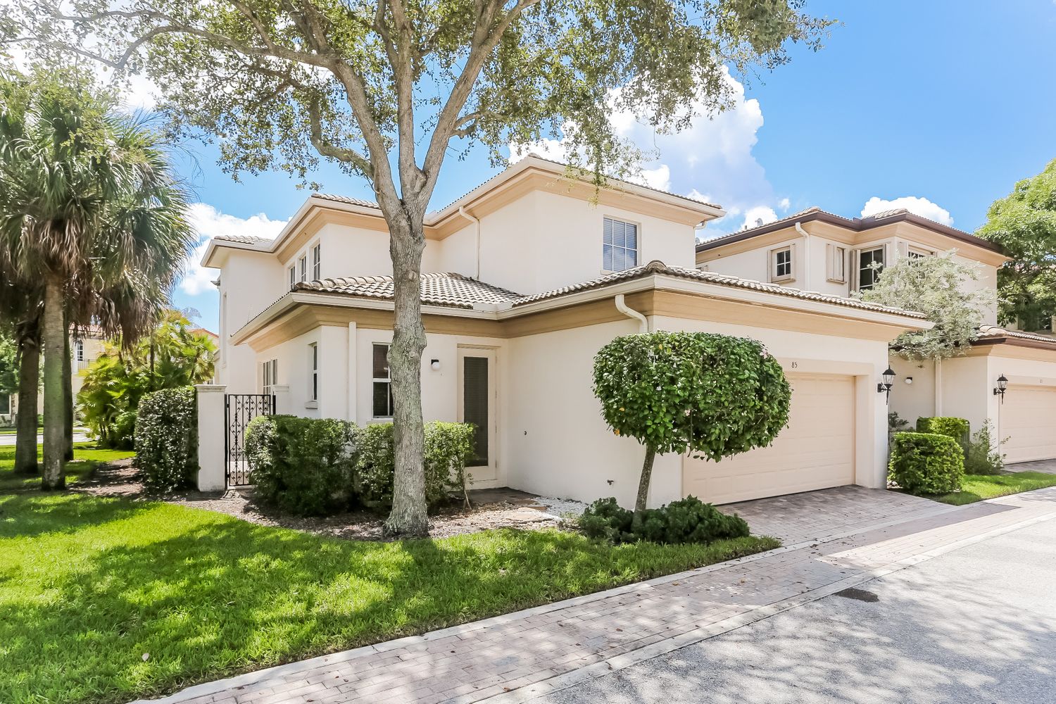 Two-story home with garage at Invitation Homes South Florida.