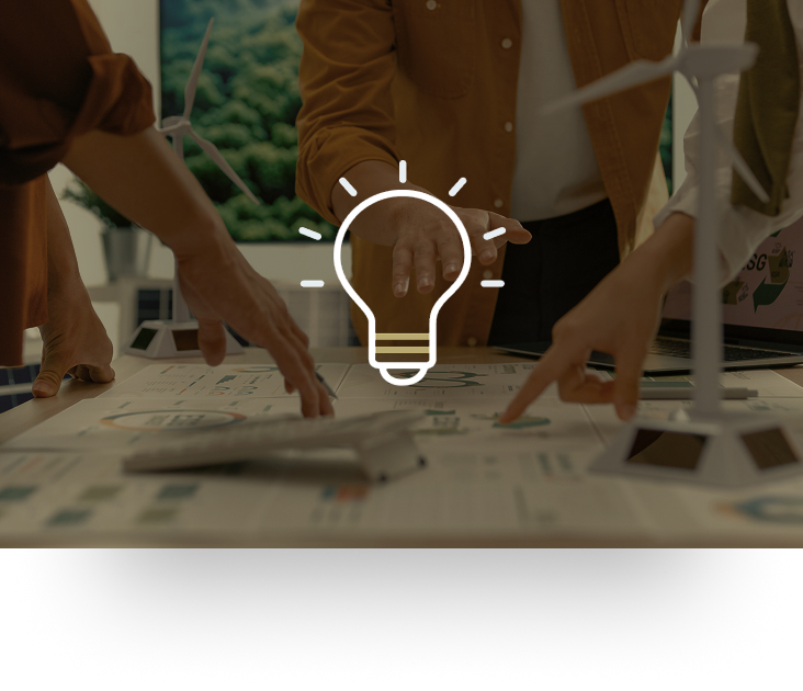 Several hands pointing at reports spread across a desk.