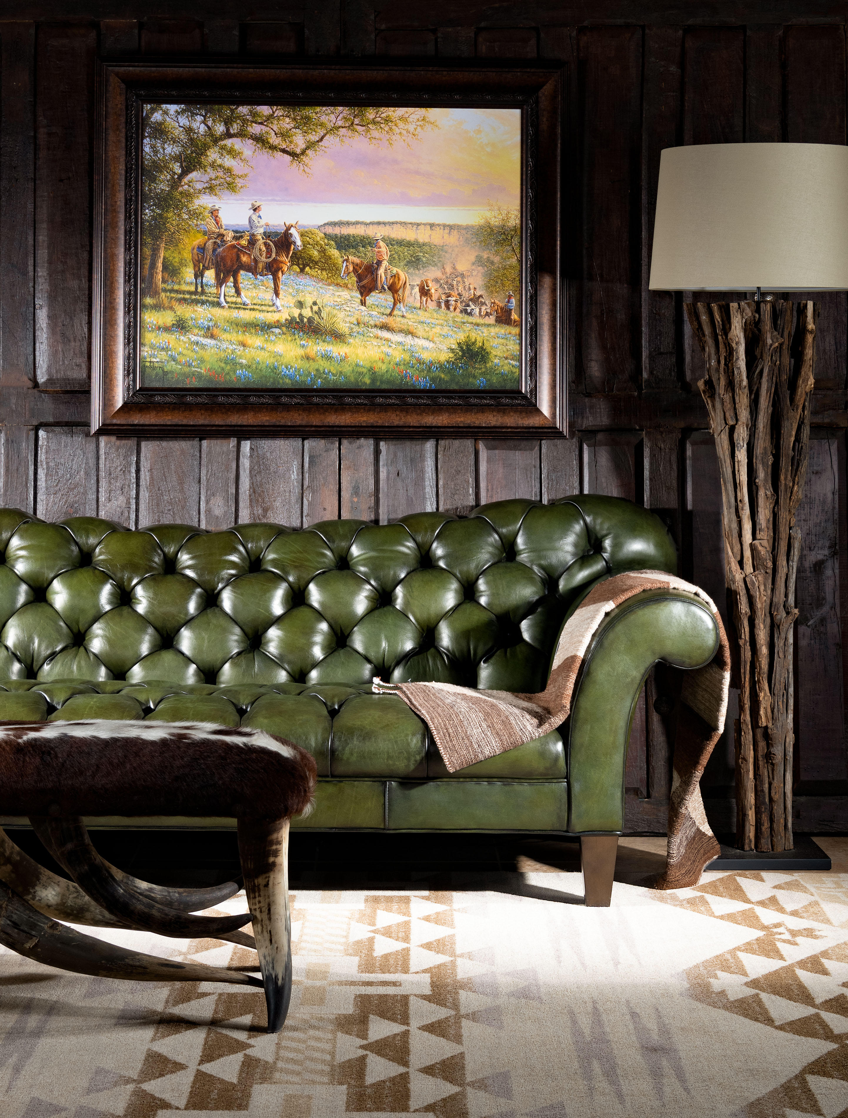 Our Daphne Leather Chesterfield Sofa is a classy, timeless piece of furniture that dominates deÌcor and conversations. This hand-tufted couch is every bit as fashionable as it is glamorous! The Daphne Chesterfield Sofa features an elegantly curving design that echoes some of the finest natural patterns. Rich, natural and beautiful olive green leather makes this couch the perfect addition to any home pursuing an upscale Western aesthetic. The Daphne Chesterfield Sofa is a prime example of the quality possible with hand-crafted furniture. Our signature hand antiqued leather gives this unique high-end sofa a patina of timeless elegance. Because of its distinctive shape and versatile finishing material, the Daphne Chesterfield Sofa is a welcome addition to virtually any sitting room or living room. This beautiful piece of leather furniture pairs well with almost any interpretation of the fine rustic aesthetic. It exudes luxury, yet can be paired with virtually any design aesthetic thanks to its simple, timeless design.