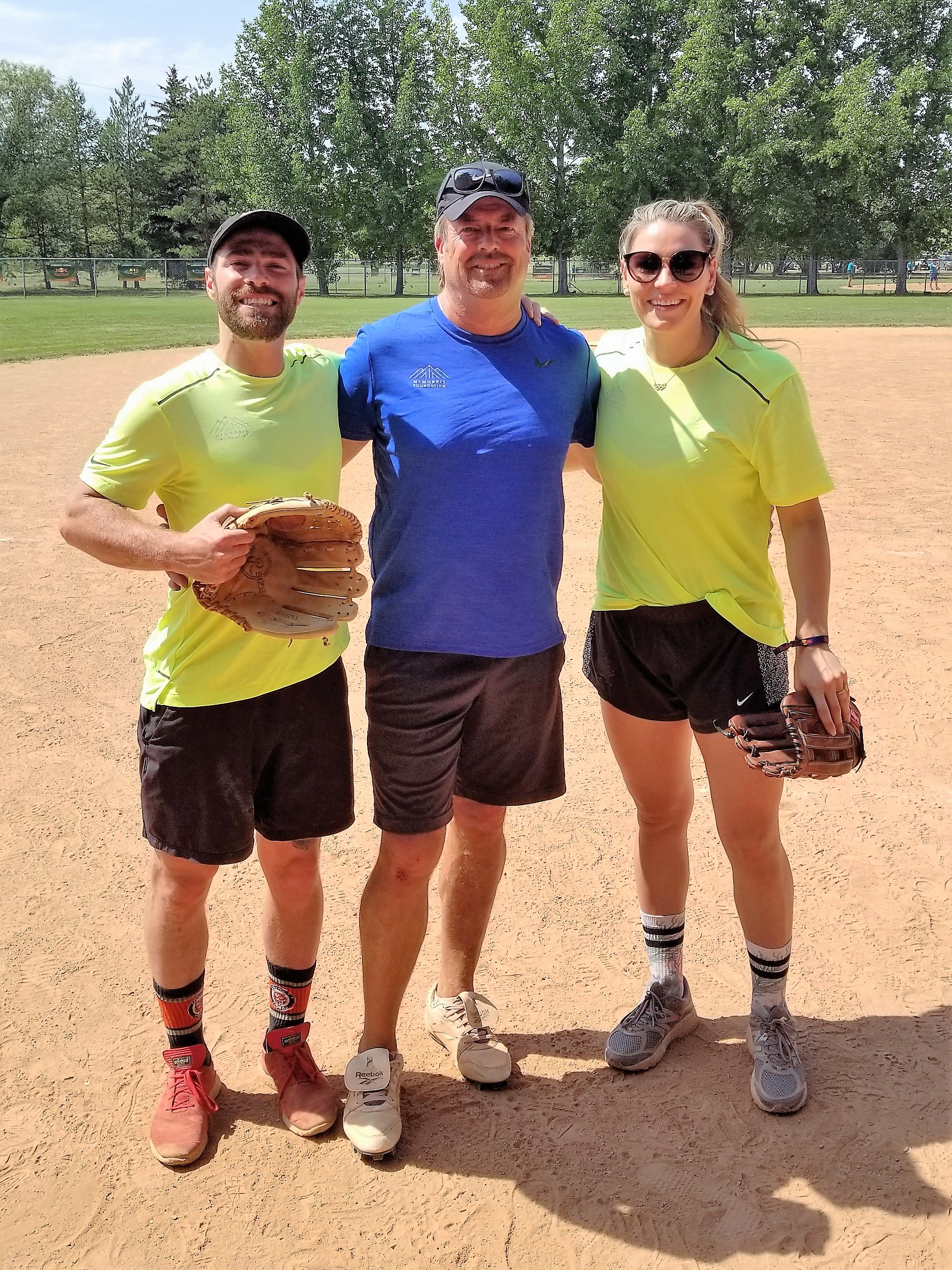 Dave takes a picture with professional snowboarder Danny Davis, and Canadian Olympic Gold Medalist Women's Hockey Player Natalie Spooner.