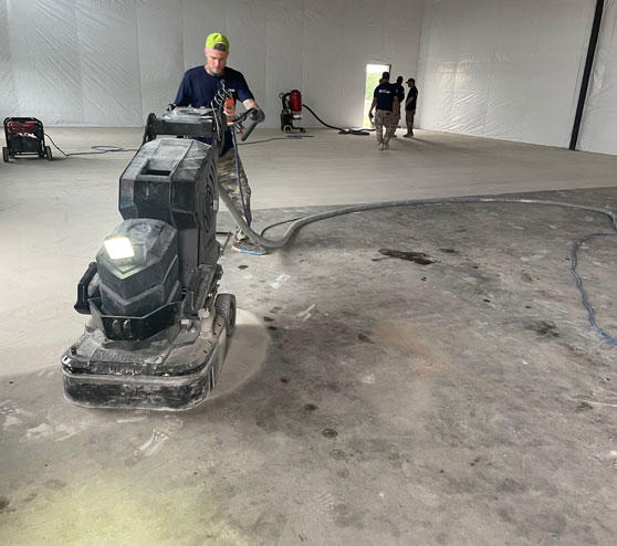 an employee grinding concrete in Burleson, tx