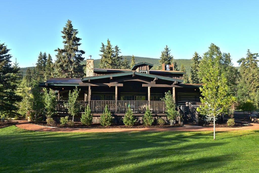 Commercial hospitality renovation completed by Reliant Construction in Colorado Springs, featuring lodge-style interior and custom wood and stone finishes.