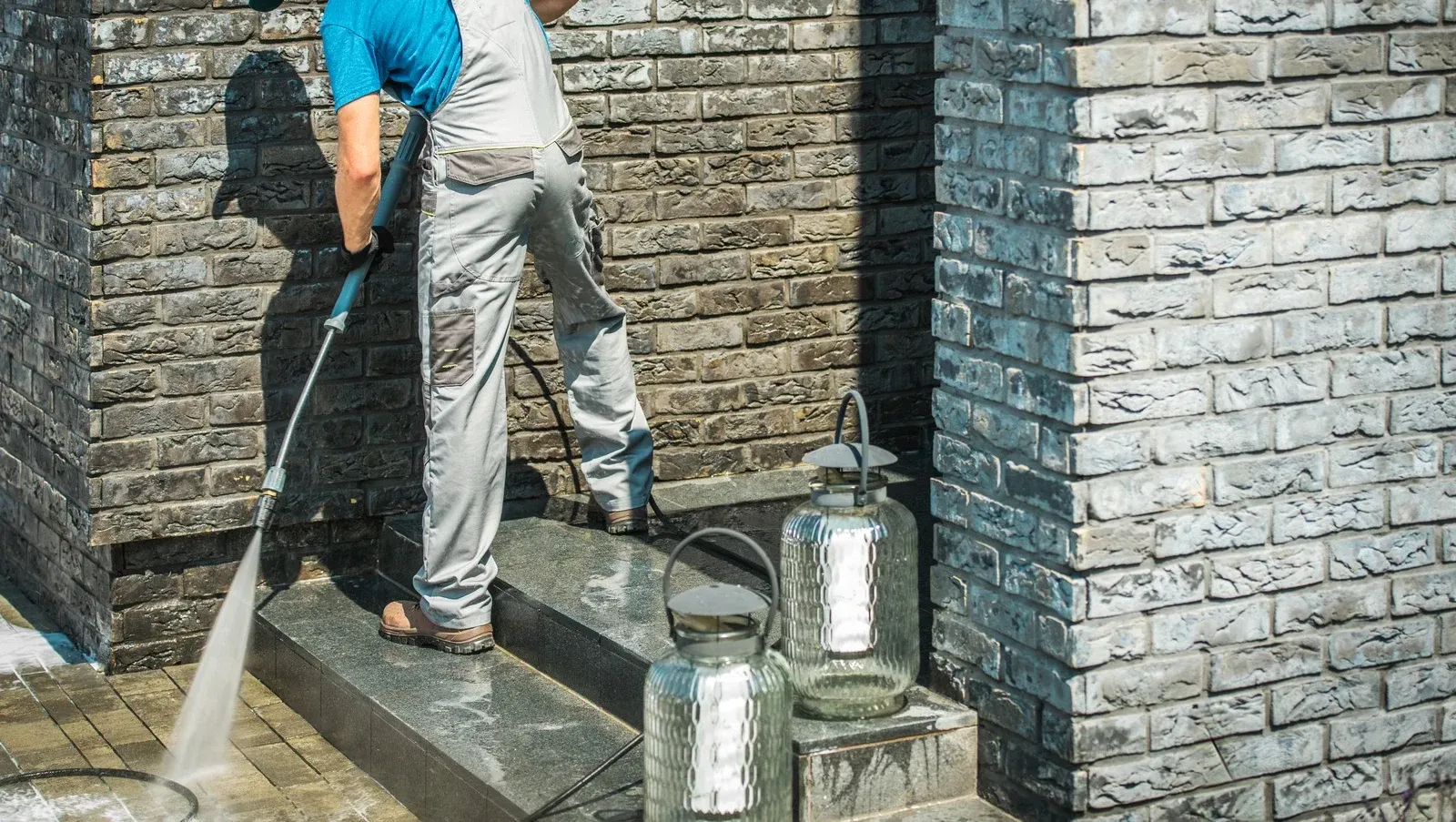 Professional cleaning of a brick home's entrance removes dirt, stains, and contaminants from masonry 