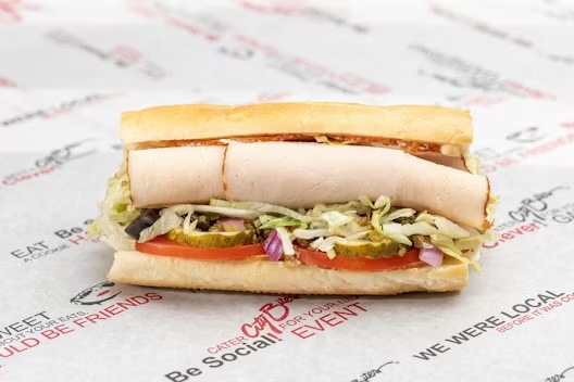 Lettuce, tomatoes, red onions, pickles, black olives, crushed cherry peppers, blended oils, mayo, salt & pepper.