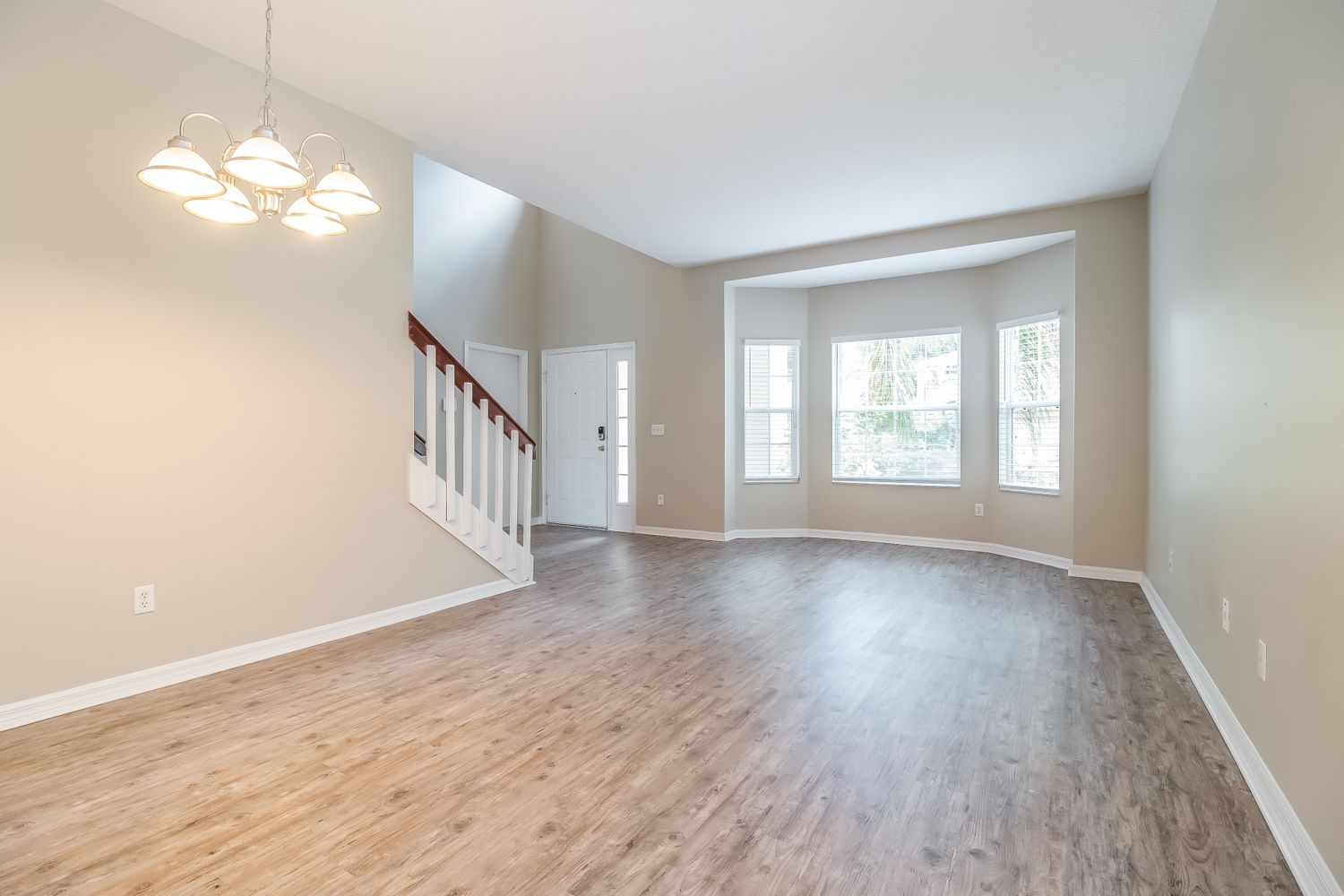 This beautiful home in Orlando, Florida features luxury vinyl plank flooring throughout the living area.