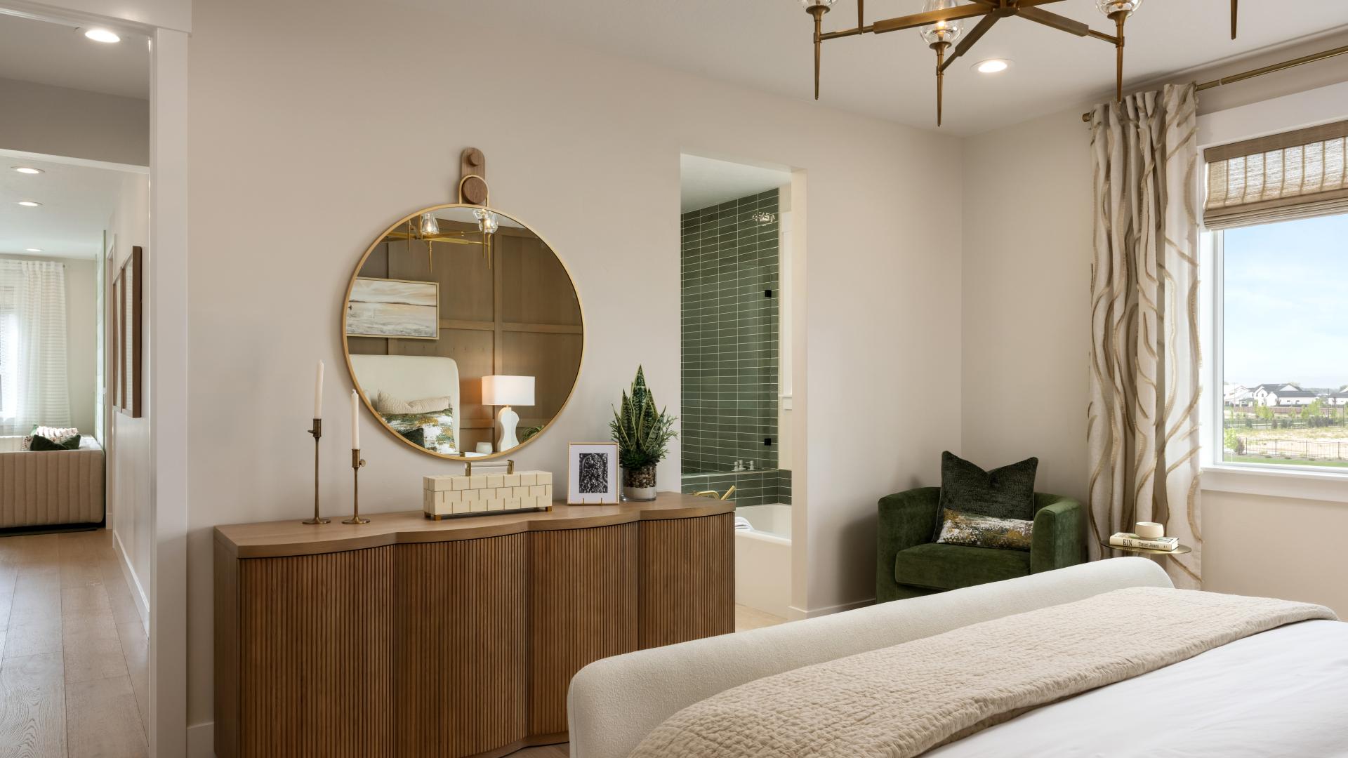 Spacious primary bedroom with plenty of natural light