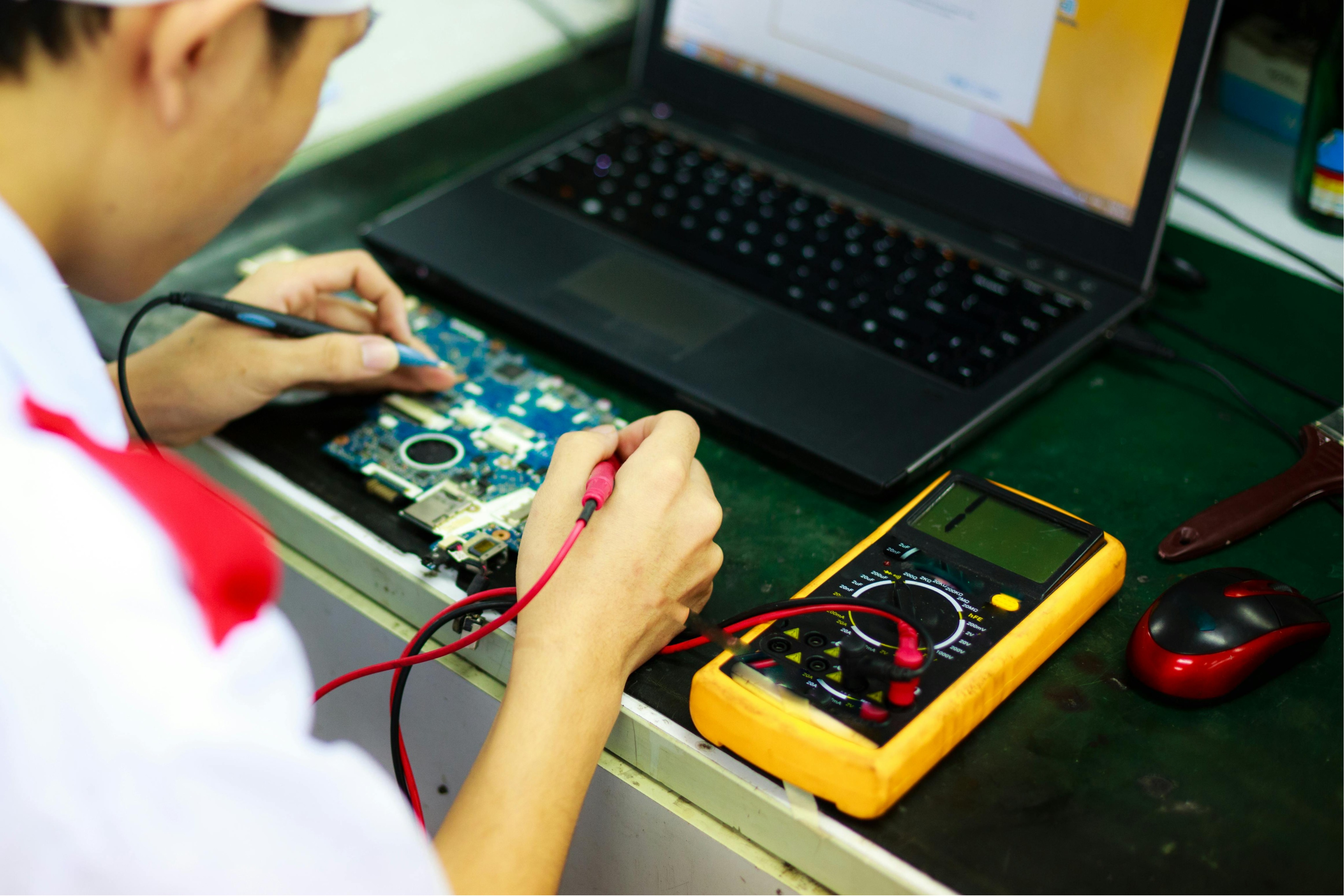 Technician Fixing a Computer