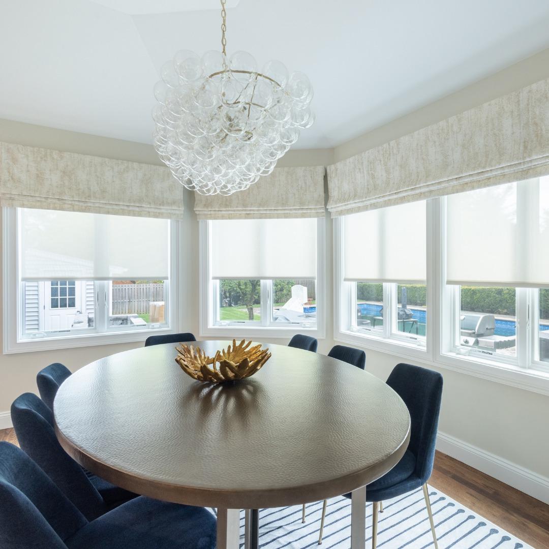 If you need unparalleled light control, look no further than roller shades. These shades provide complete coverage throughout your space and add a modern and timeless touch. We love how this customer added complementary valances to their shades to bring a sense of softness to this dining room.