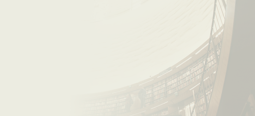 A beautiful curved library with a well-lit ceiling.