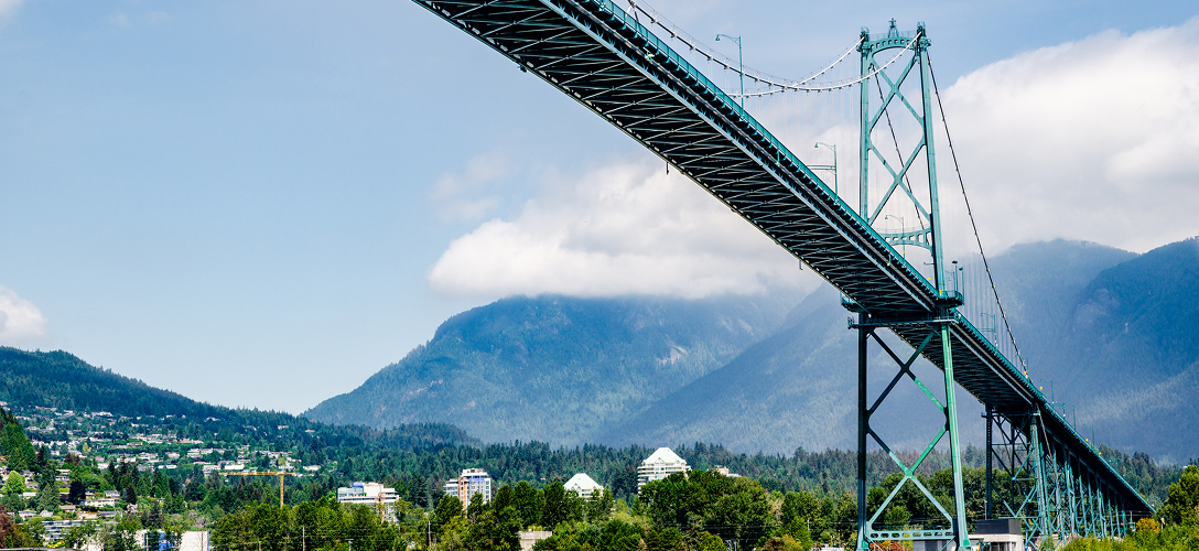 Vancouver's landmark Lions Gate Bridge and the surrounding city and mountains.