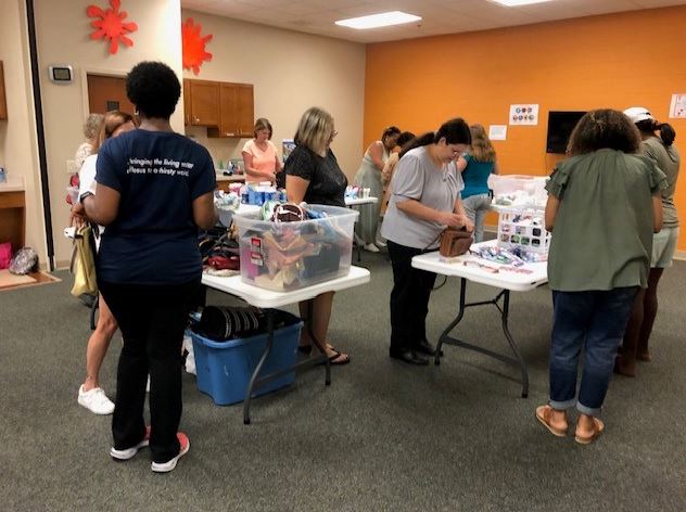 We were proud to support Living Water Community Church, in Harrisburg, where we dedicated a morning to lend practical support to their “She’s Somebody’s Daughter” with organizing donated items and purses for distribution.