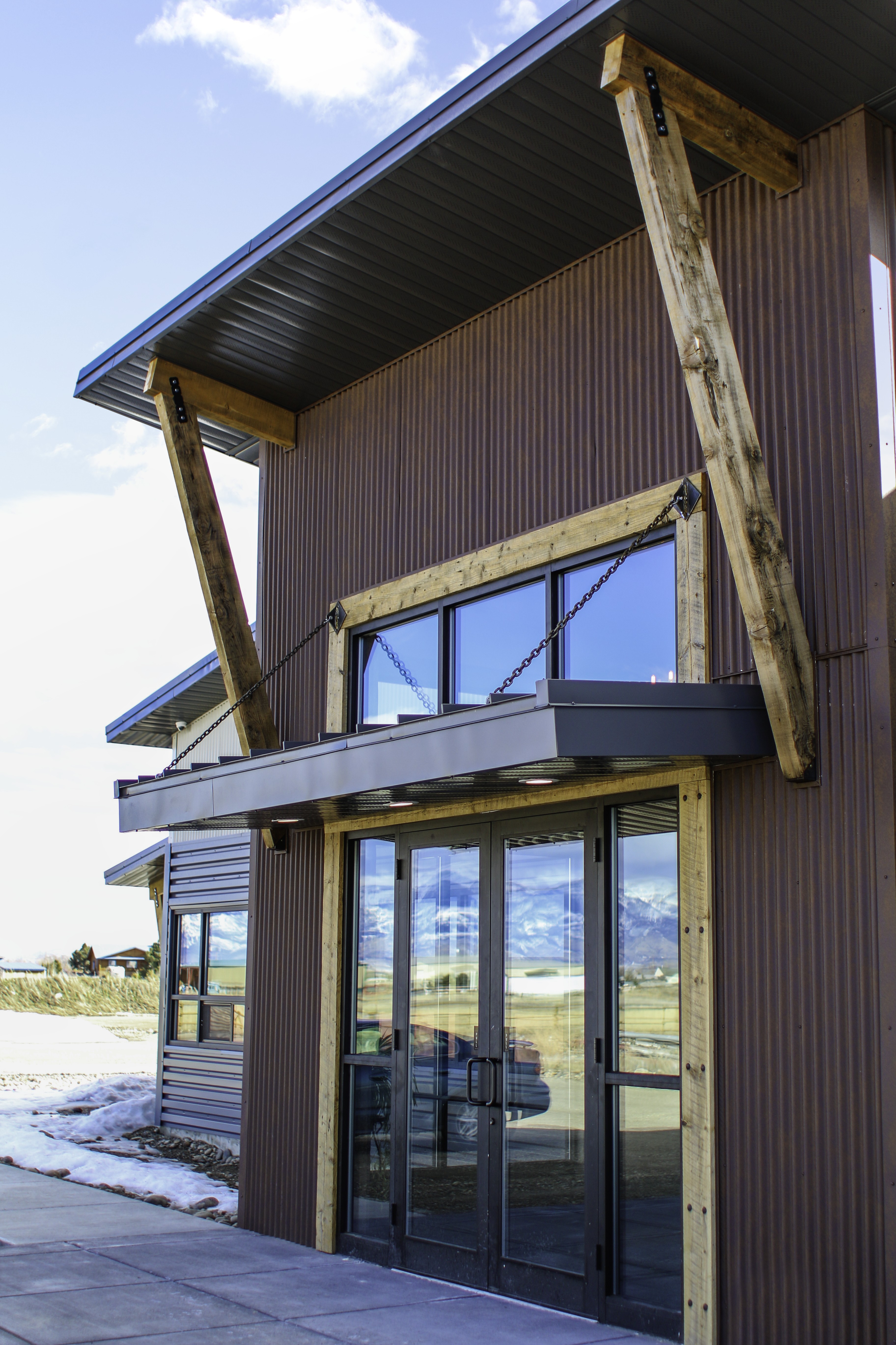 Close-up of metal siding and roofing materials, showcasing durable finishes and clean architectural detailing designed for long-term performance.