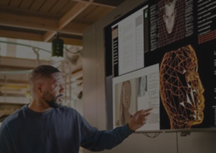A professional presenting their research in a high-tech office setting.
