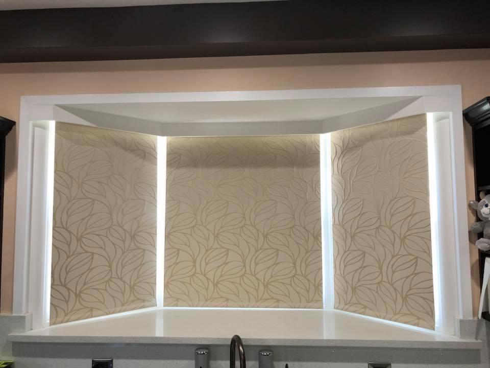 Unique idea for bay windows...group together 3 graphic roller shades.