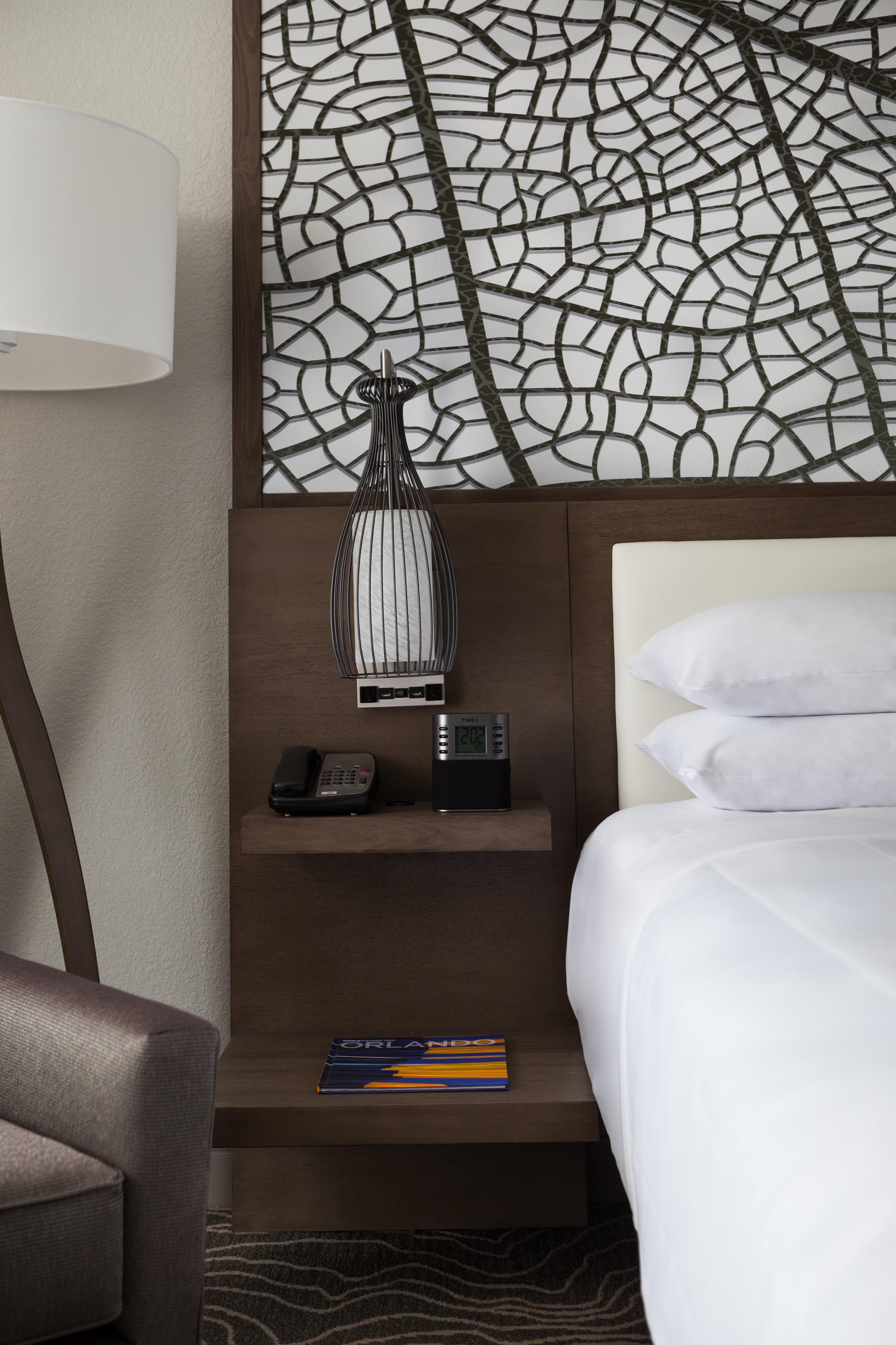 Our hotel rooms feature modern décor, lighted headboards and cutting-edge technology.