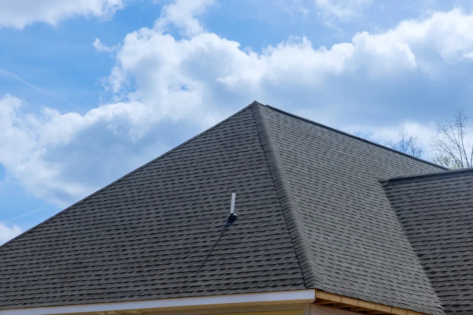 New asphalt shingle roof installed on a residential property, demonstrating expert workmanship and reliable protection. The roofing system improves durability, weather resistance, and overall property value.
