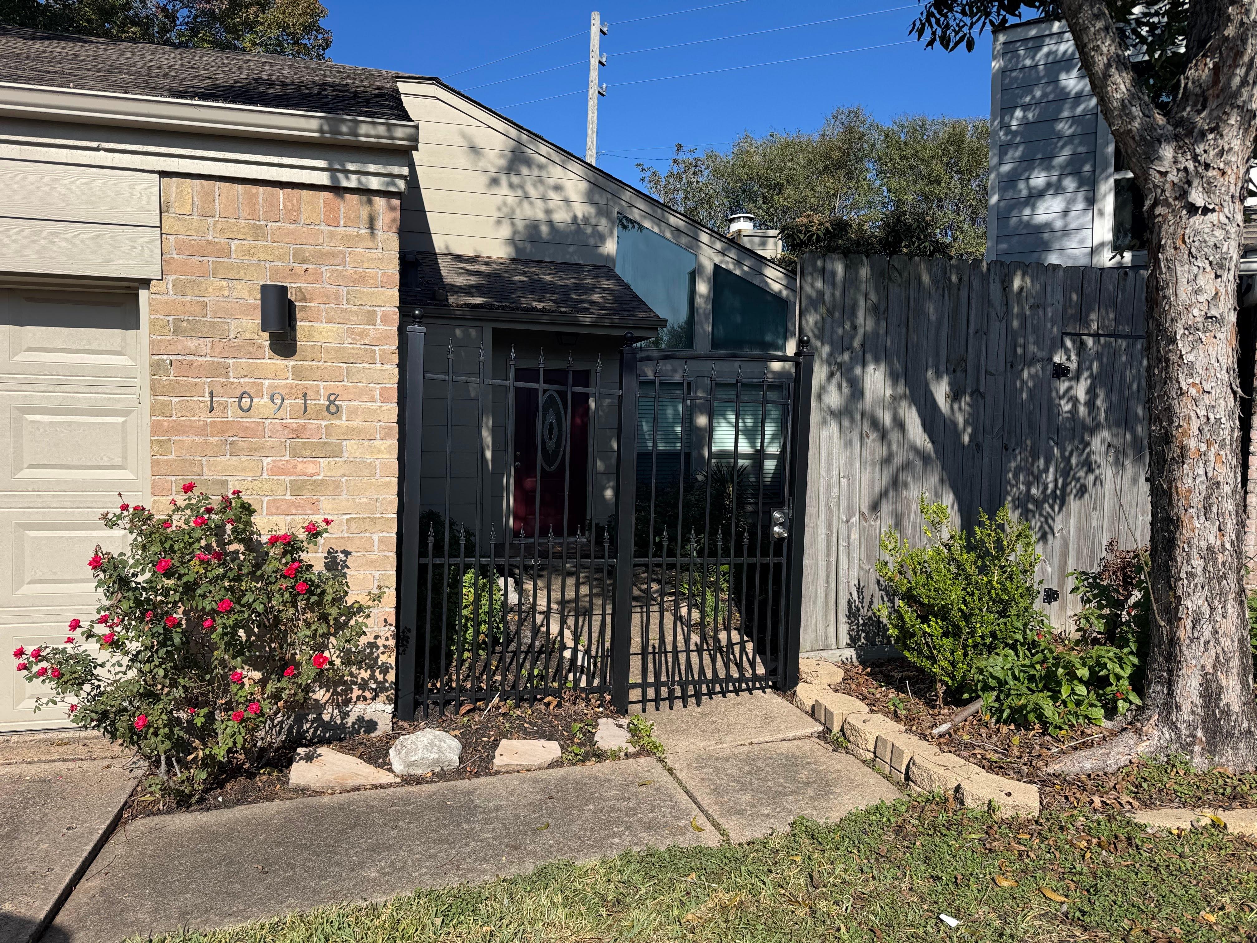 Repaired black wrought iron front gate at a residential home in Houston, Texas.
