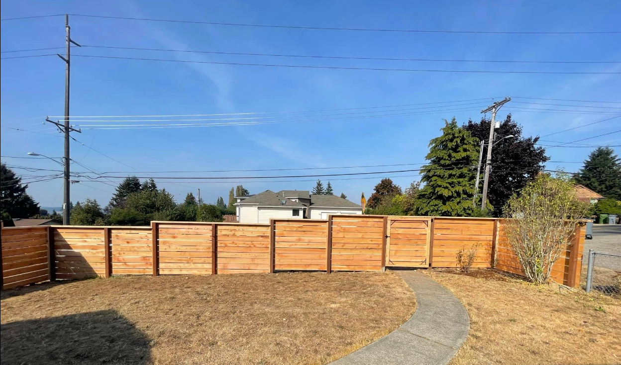 This is an example of a high-quality large cedar fence install, we are fully equipped to handle any sized job.