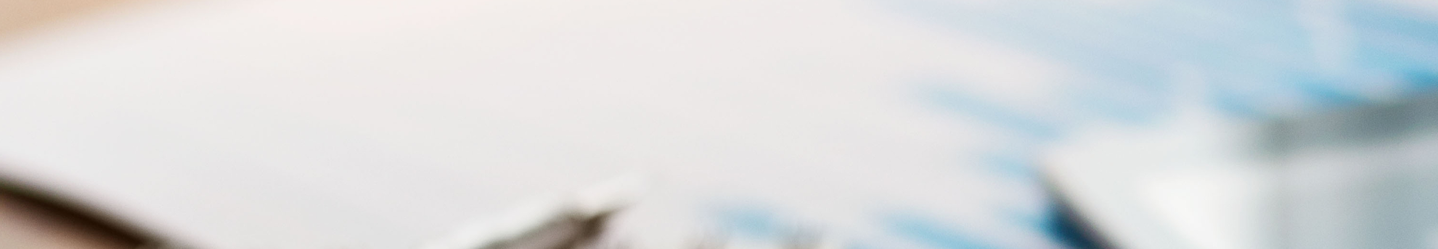 A pen and tablet out of focus.