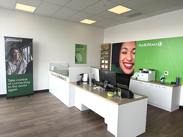 Interior photo of reception desk in the AudioNova hearing clinic in Downers Grove, IL
