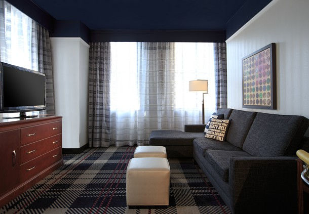 Enjoy a flat screen television, separate living area, and panoramic views in our lavish corner king hotel room.