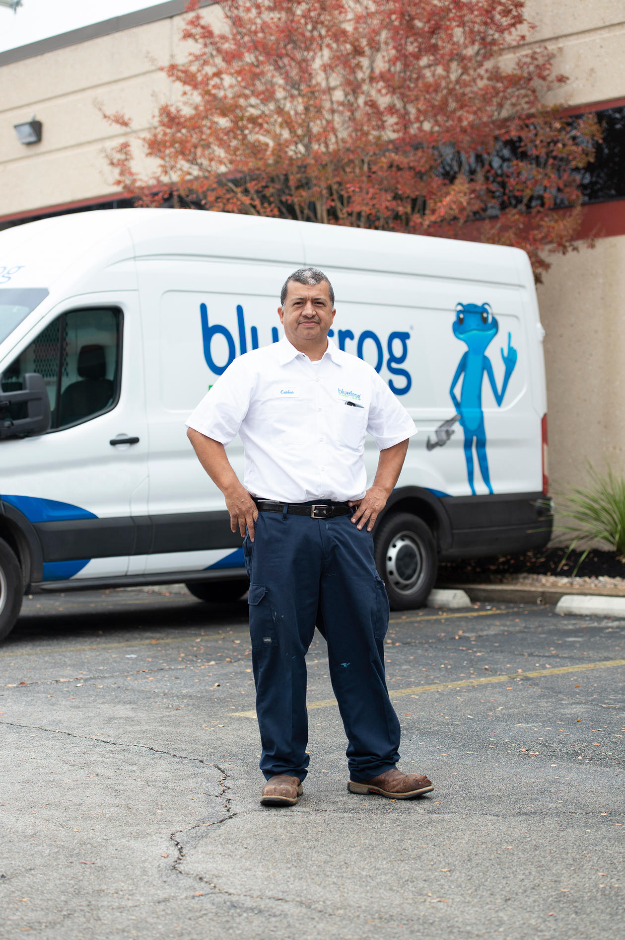 Service tech in front of a bluefrog Plumbing + Drain service van ready to install water filtration systems in New Orleans LA homes.
