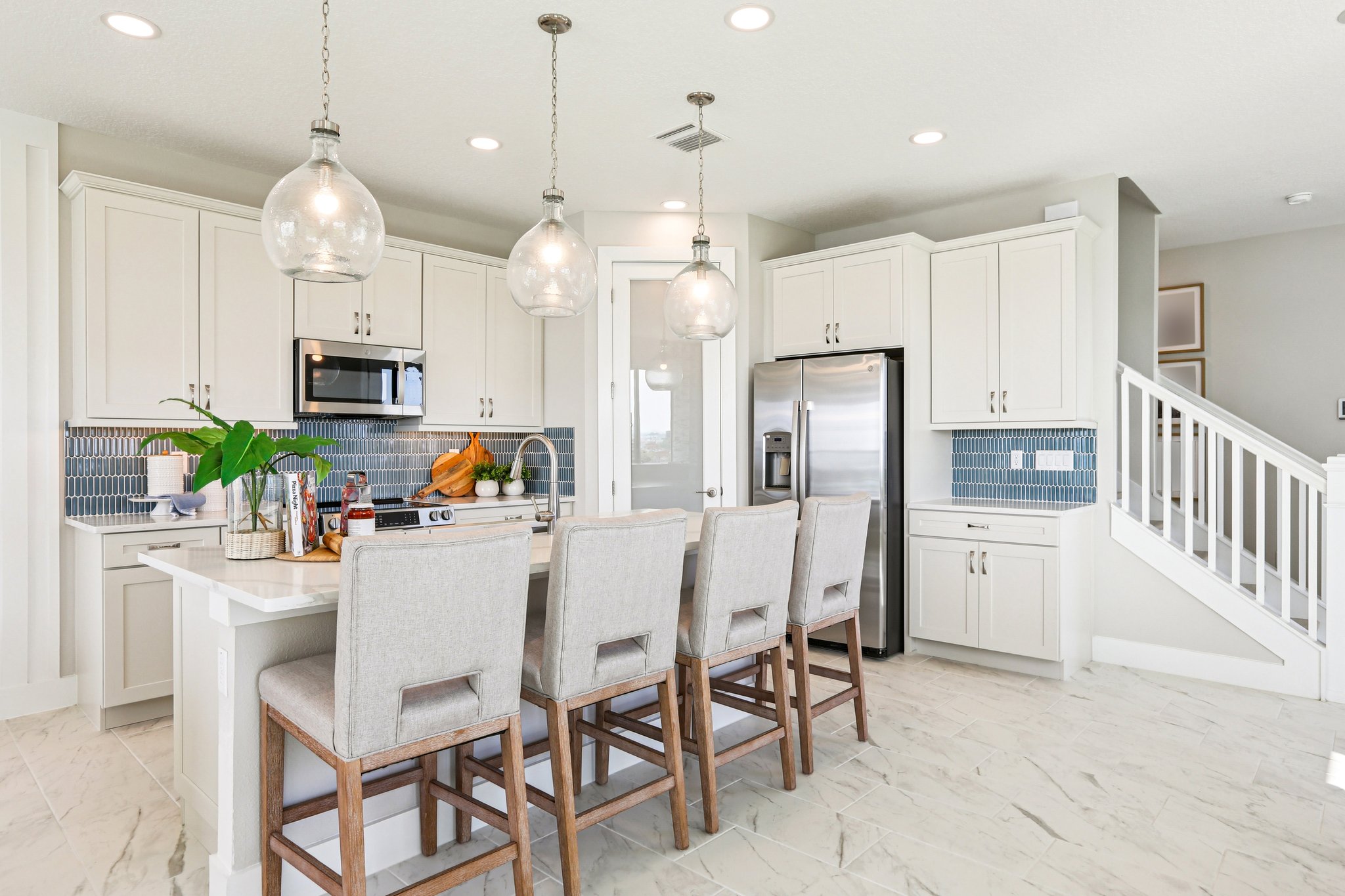 The Kitchen of a DRB Homes Bimini Home Plan at Isla Mirada in San Antonio, FL. 