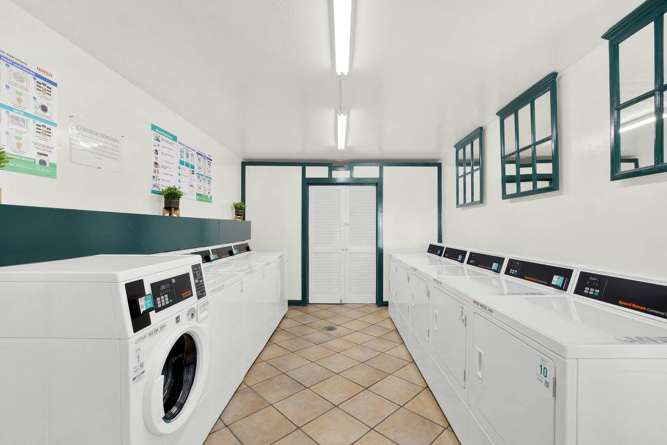 a washer and dryer in a laundry room with washing machines