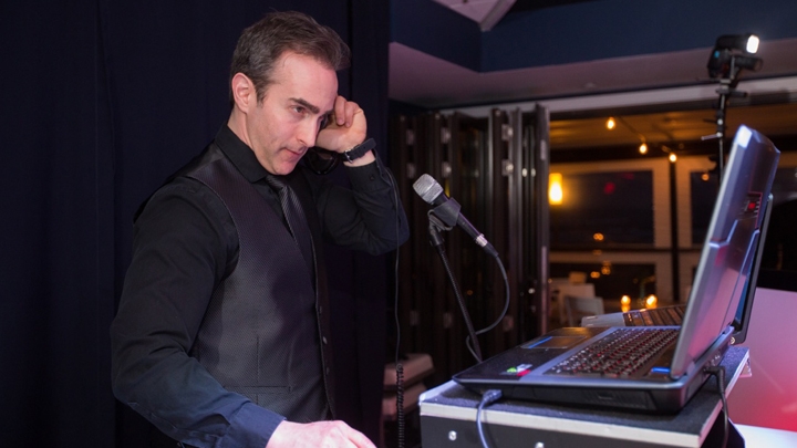 DJ Adam Mixing His Music For Party Guests