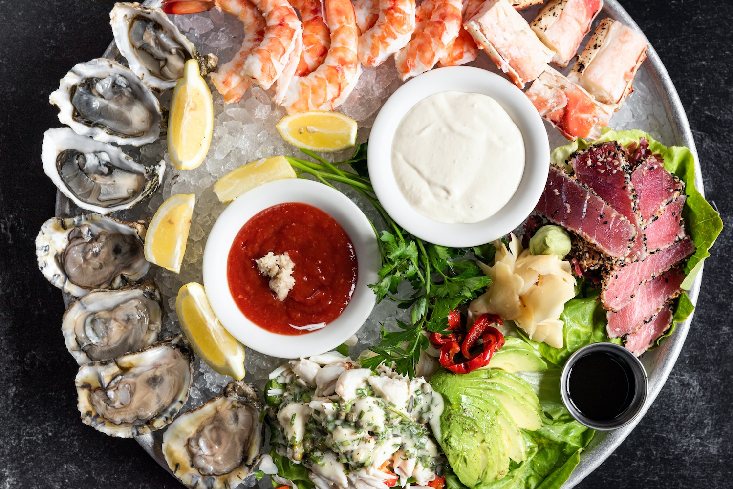 Experience the ultimate taste of the ocean with our signature Seafood Platter at Gibsons Bar & Steak 