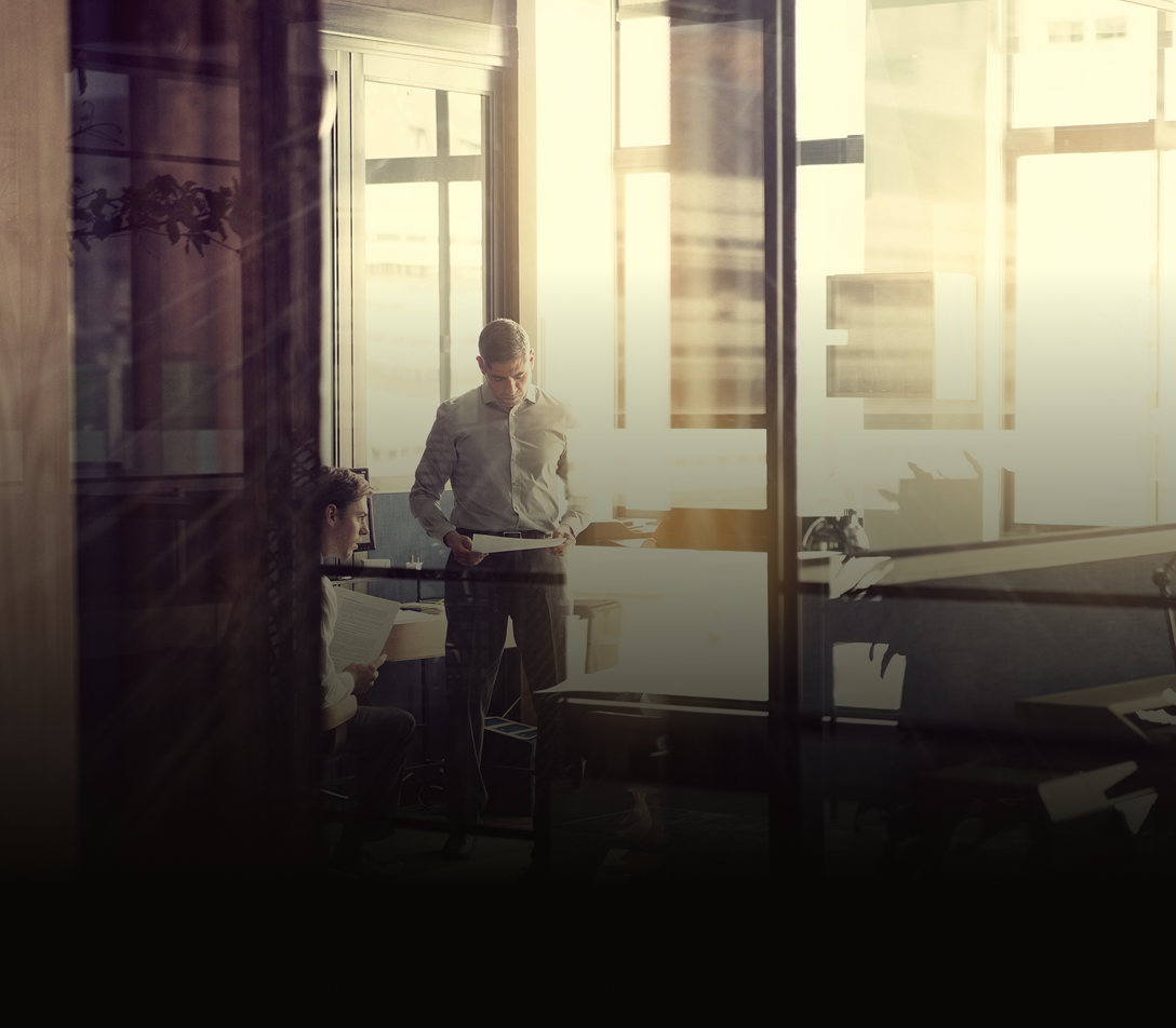 Show of two professionals collaborating in an office setting.