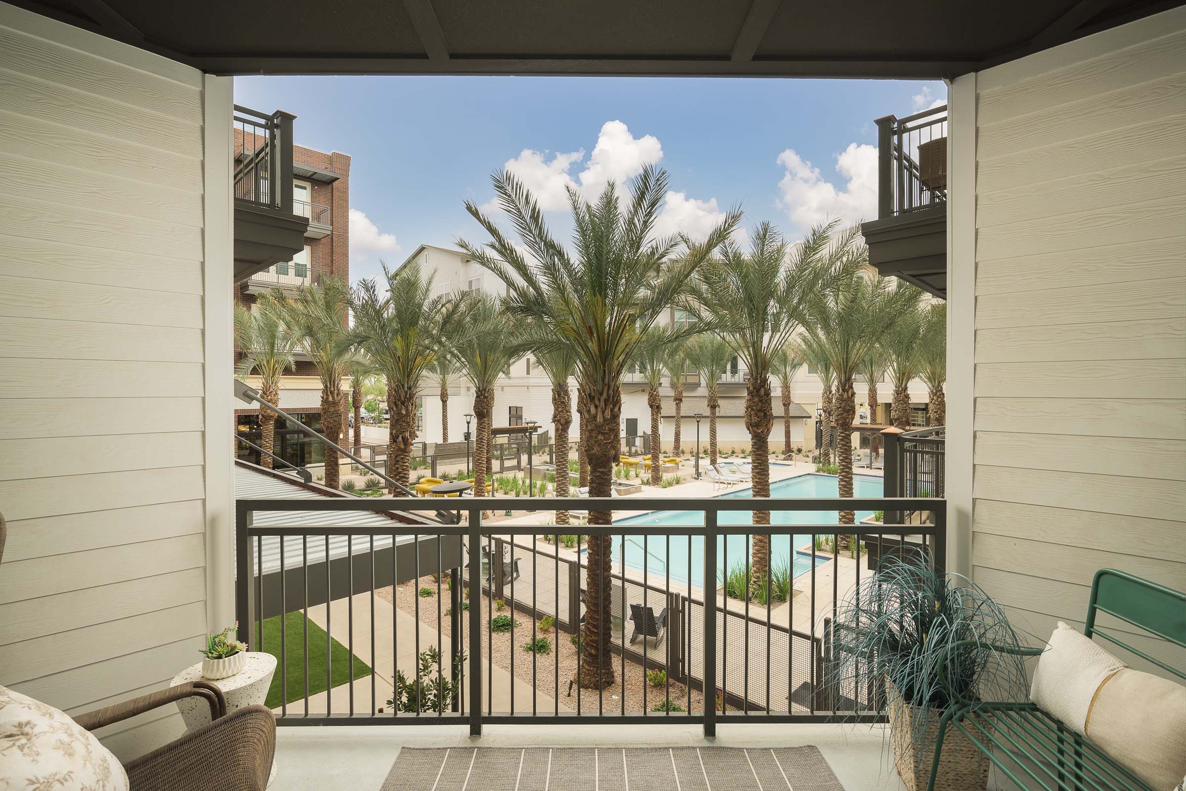 private balcony overlooking the pool at Camden Gilbert apartment homes in Gilbert, AZ