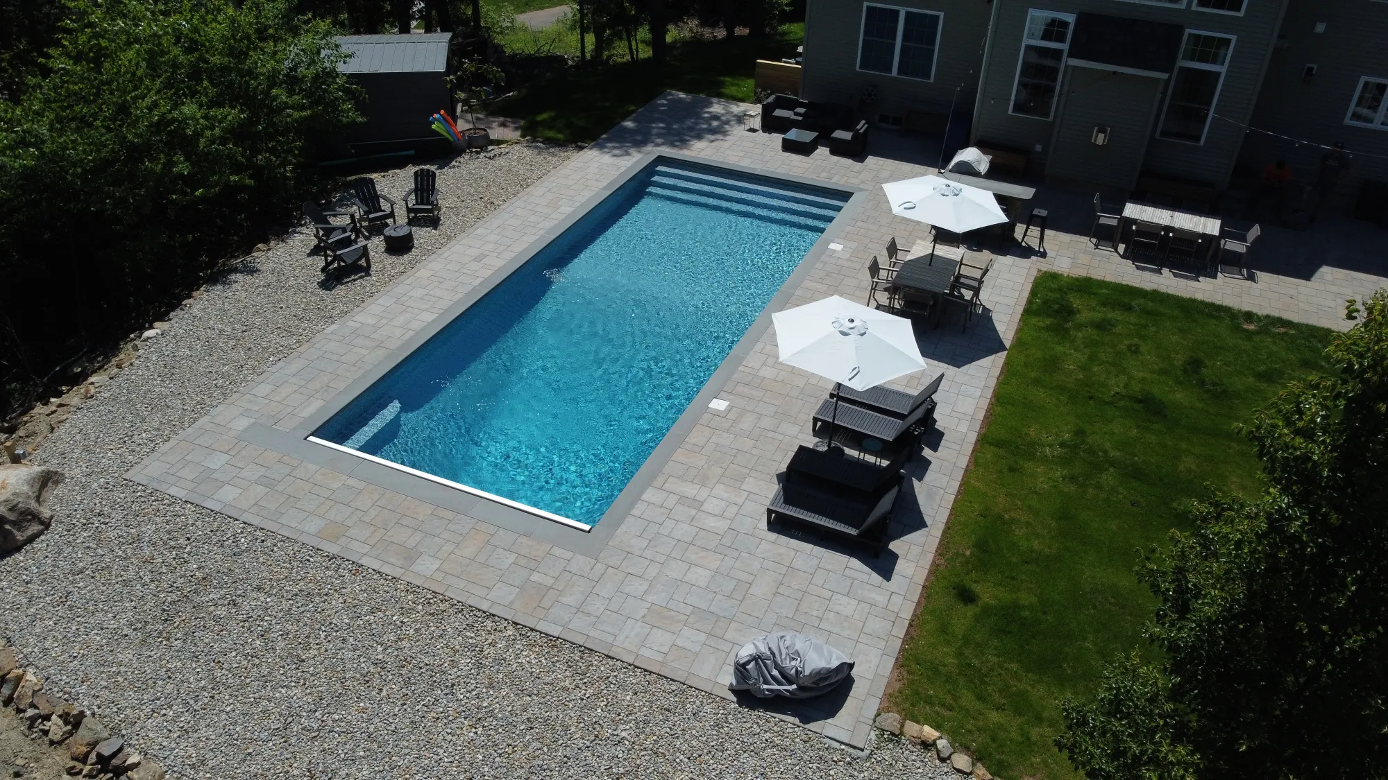 Overhead view of a paver pool deck and patio area - Paver Pool Decks project by General Masonry LLC.