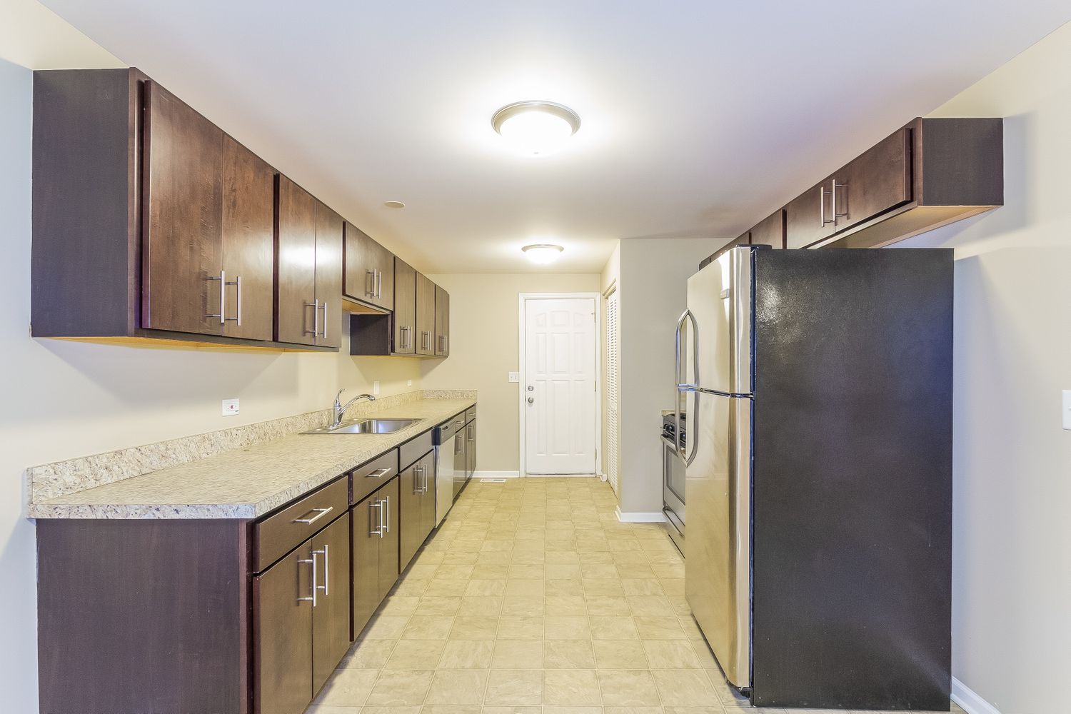 Kitchen with plenty of storage and stainless steel at Invitation Homes Chicago.