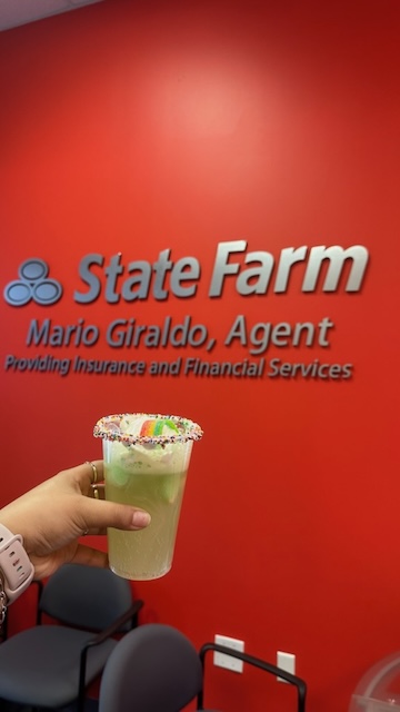 Celebrating the holidays at Mario Giraldo's State  Farm office!