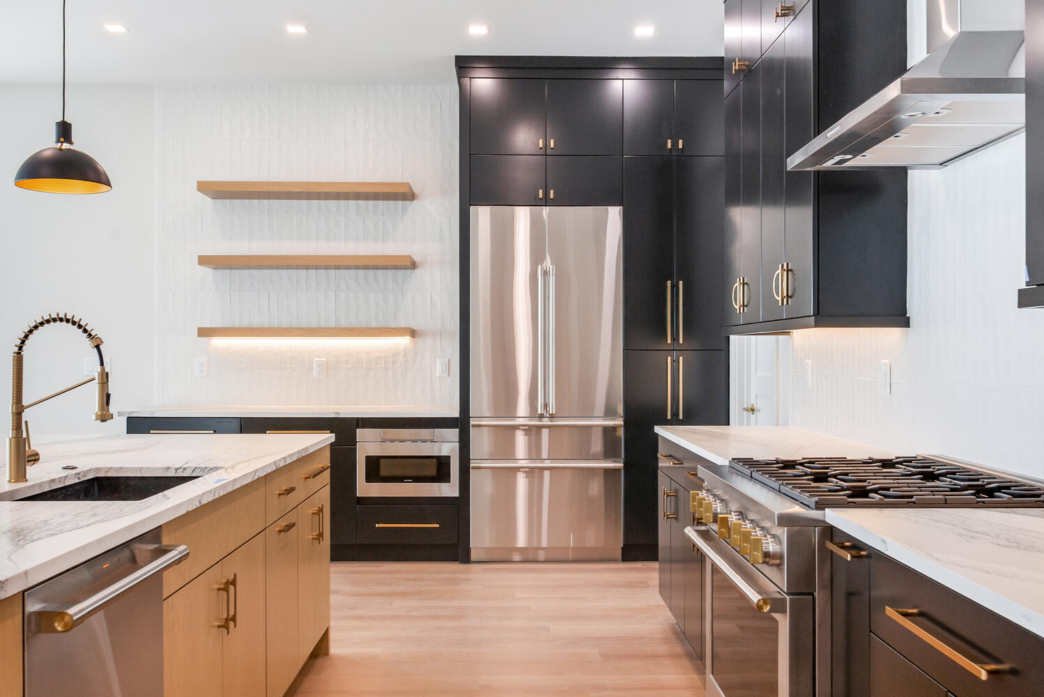 Modern kitchen design with sleek dark cabinetry, warm wood accents, open shelving, stainless steel appliances, and high-end fixtures.