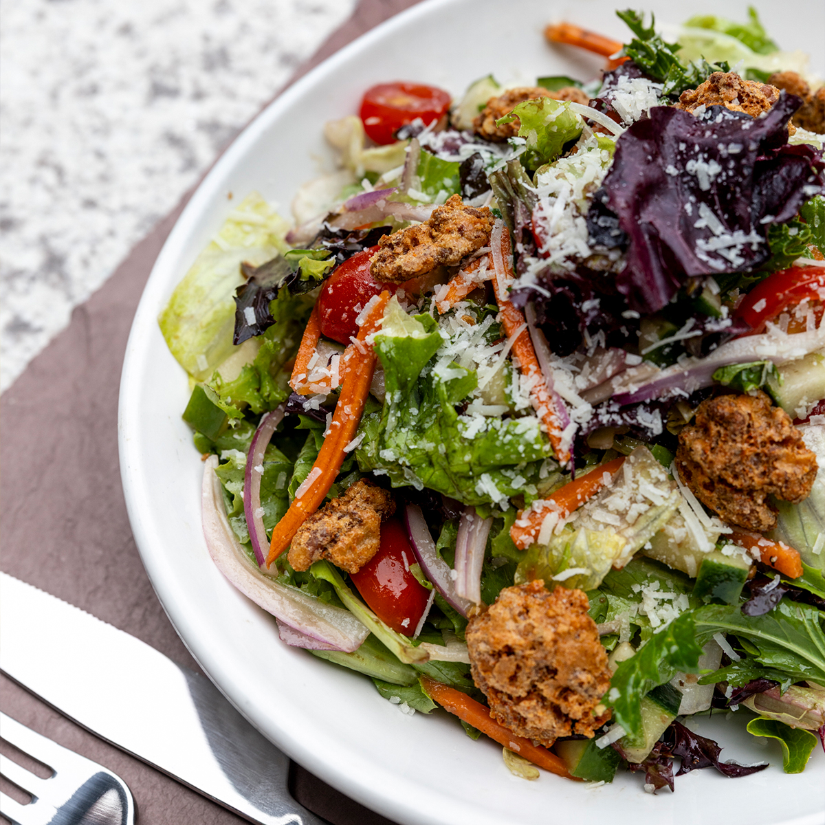Redstone House Salad | tomato, carrot, cucumber, onion, parmesan, walnuts, balsamic