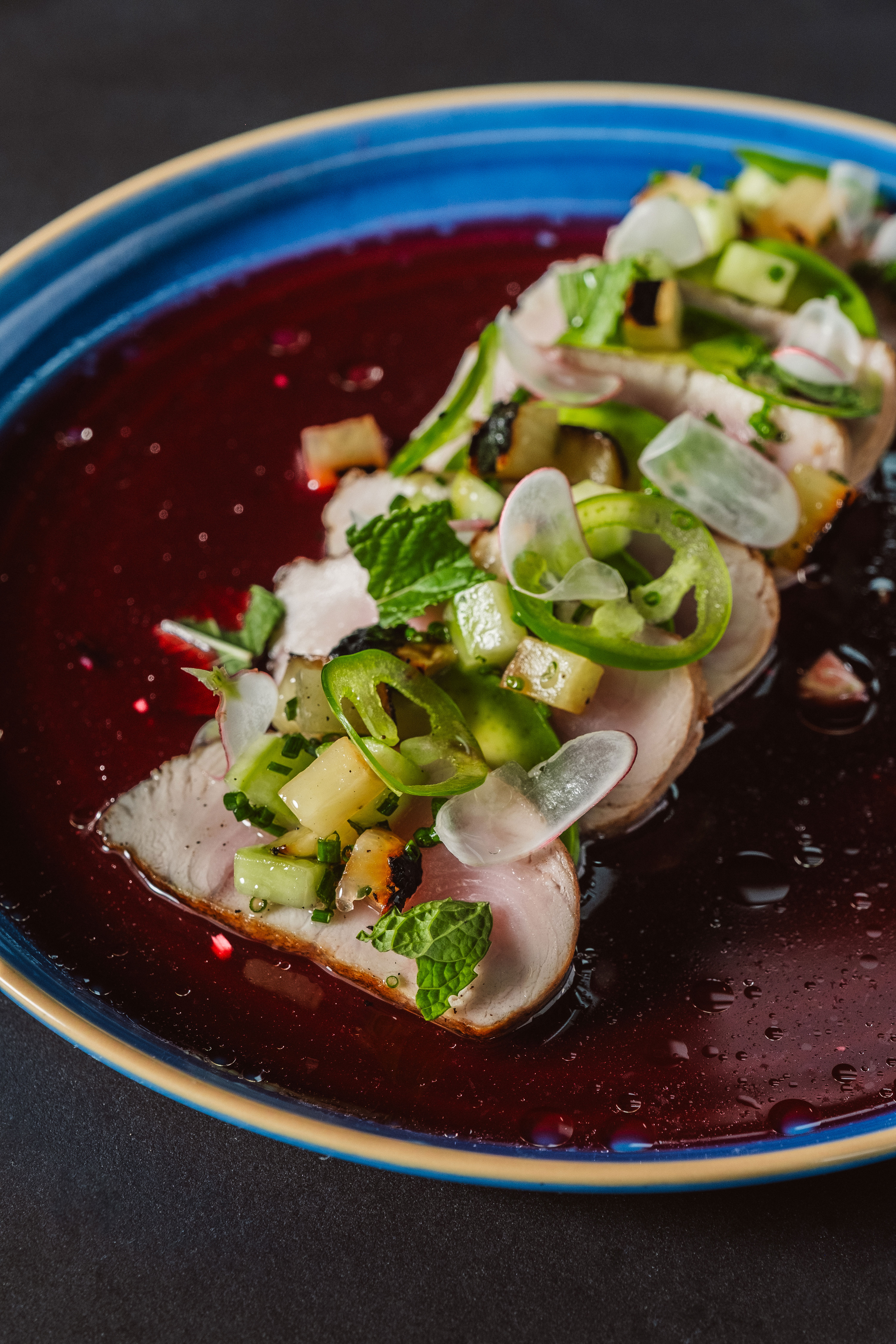 Hamachi crude served with red onion, grape tomatoes, cucumber, mint, cilantro, ruby grapefruit, Cara 