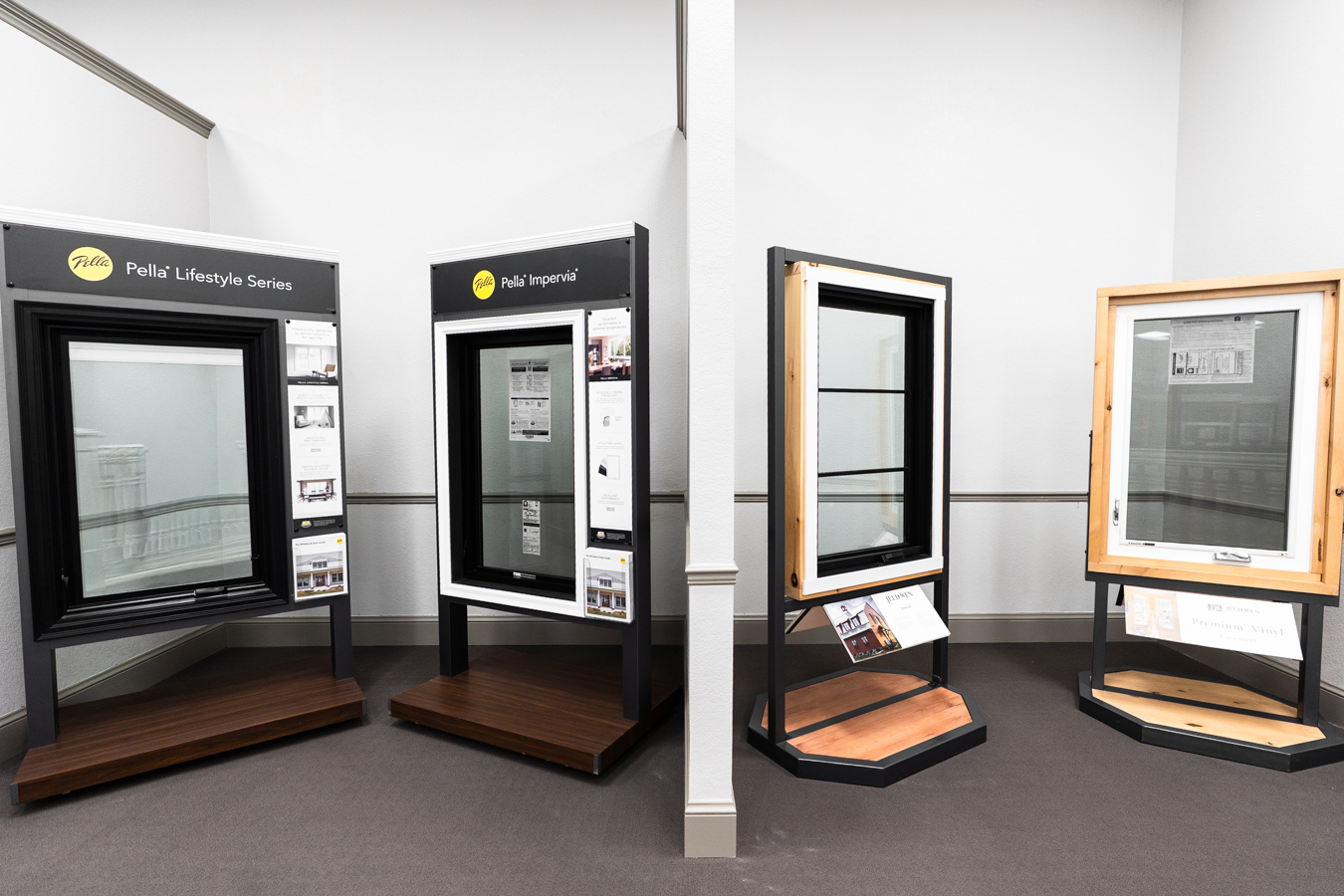 Builders FirstSource window display featuring Pella Lifestyle and Impervia series, showcasing modern design and materials.