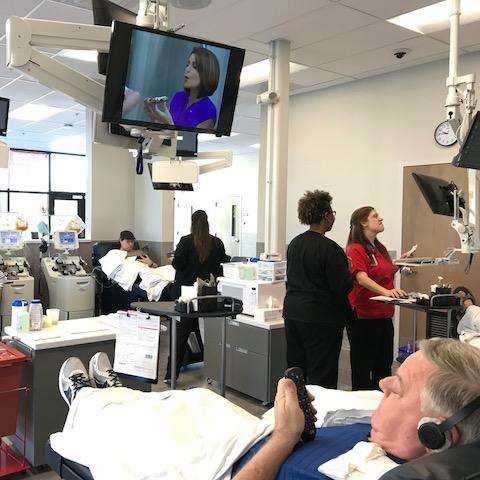 Blood donors donating blood at Community Blood Center Olathe donation center.