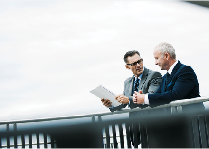 Two professionals reviewing documents.