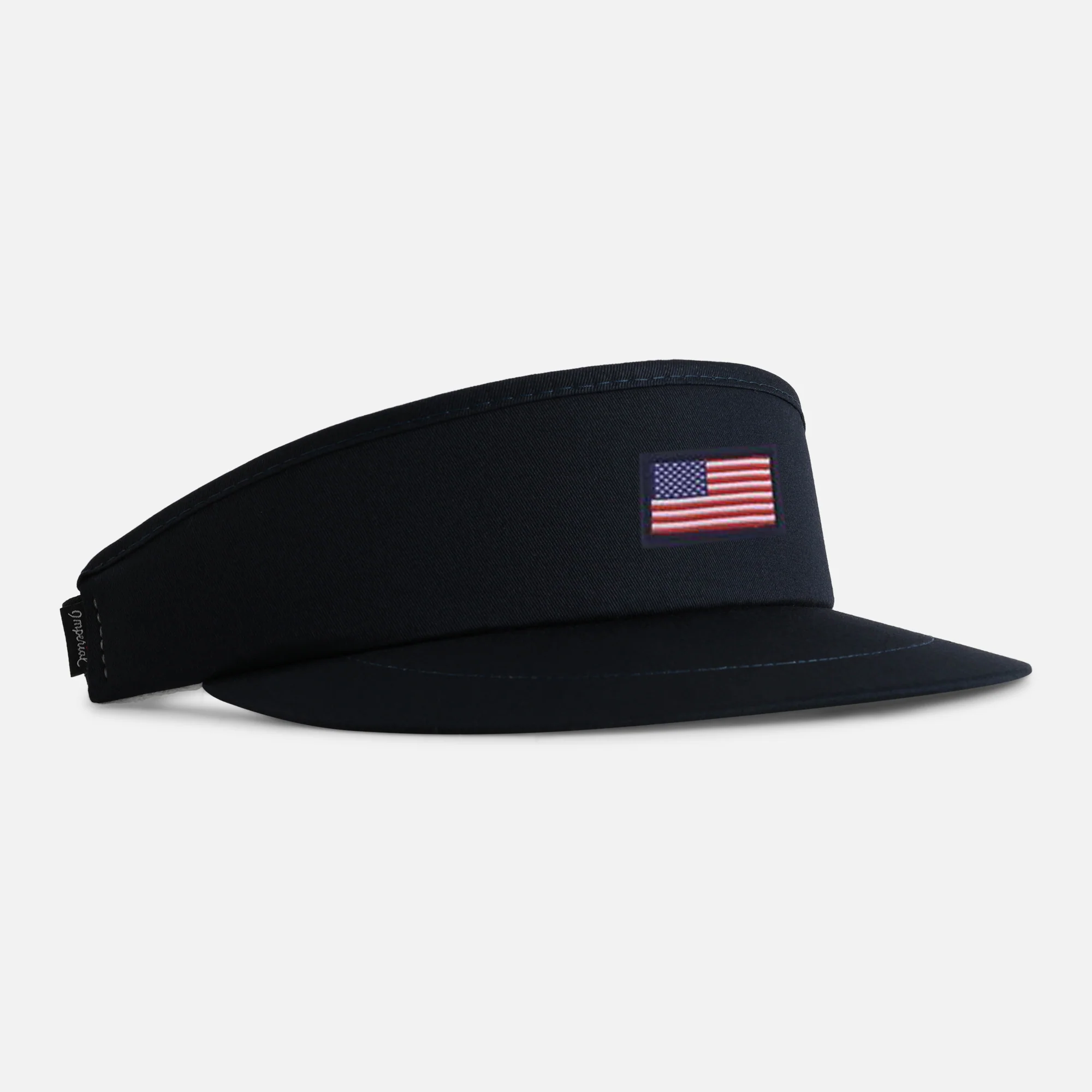 Tour Visor&reg; in navy with a woven US flag patch - a flatter, finer-detail finish than embroidery.