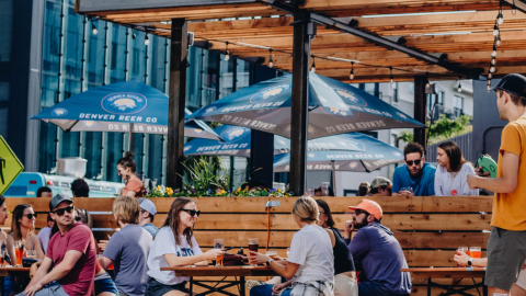 Guests gather on the outdoor patio at Denver Beer Co. Platte Street to enjoy craft beer, food, and community events.