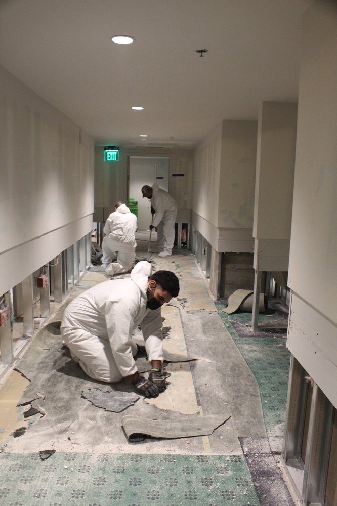 Our technicians cleaning debris, creating flood cuts, removal of wet materials from the commercial water damage in Sacramento.